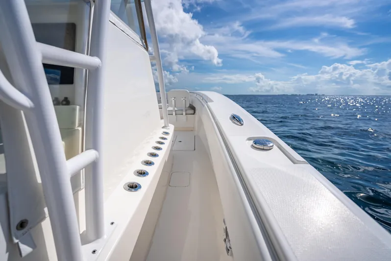  Yacht Photos Pics 2018 Invincible 36 boat on open water under a bright blue sky.