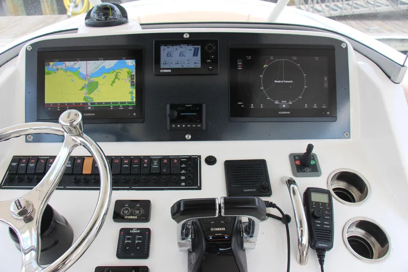  Yacht Photos Pics Control panel of a 2016 Pursuit S 280 Sport boat with Garmin navigation displays.