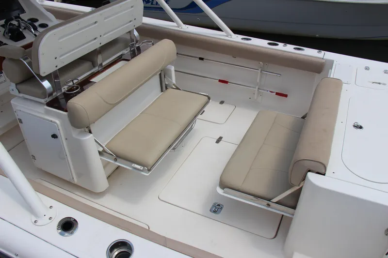 Yacht Photos Pics 2016 Pursuit S 280 Sport boat interior with beige seating and cup holders.