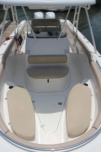  Yacht Photos Pics 2016 Pursuit S 280 Sport boat interior with beige seating and spacious layout.