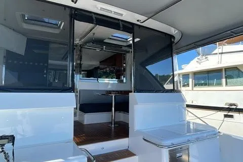  Yacht Photos Pics 2025 Riviera 585 SUV yacht interior with modern design and spacious seating area.