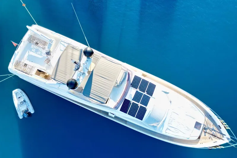  Yacht Photos Pics Aerial view of 2008 Ferretti Yachts 830 with solar panels on calm blue water.