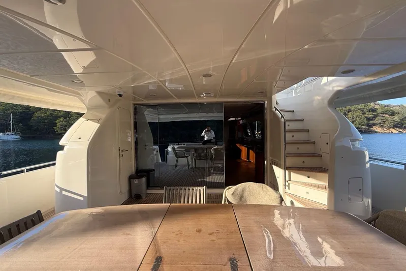  Yacht Photos Pics Luxurious 2008 Ferretti Yachts 830 interior with elegant dining area and scenic ocean view.