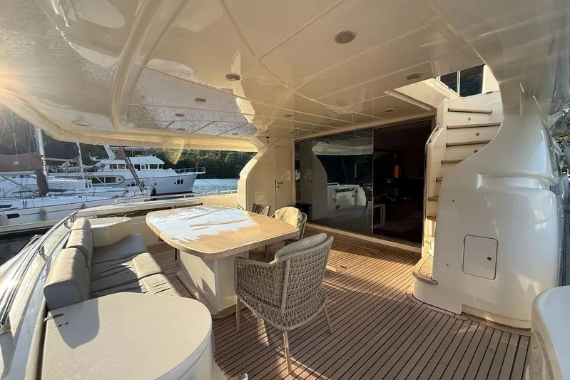  Yacht Photos Pics Luxurious 2008 Ferretti Yachts 830 deck with elegant seating and dining area.