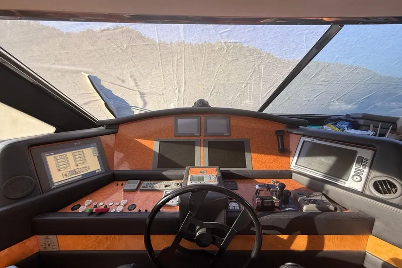  Yacht Photos Pics Cockpit of 2008 Ferretti Yachts 830 with navigation equipment and steering wheel.
