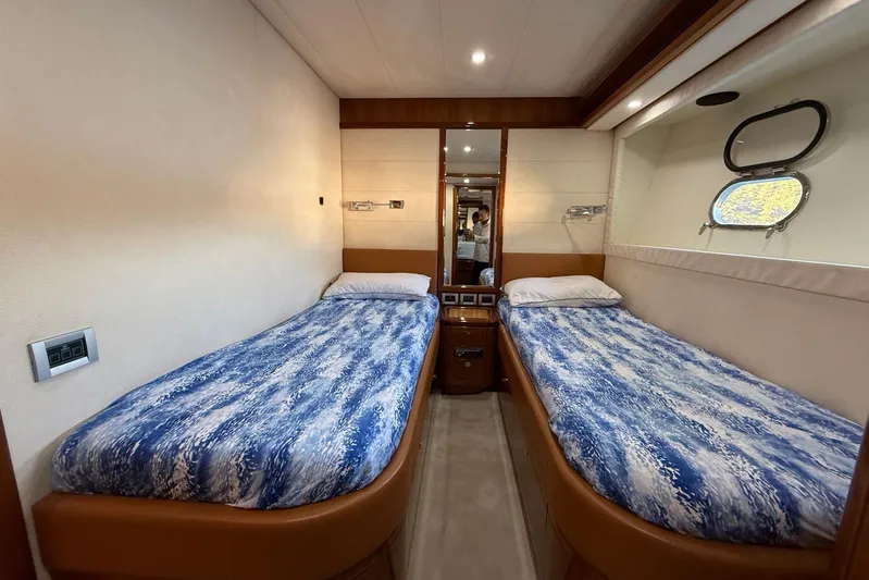  Yacht Photos Pics Luxurious twin cabin interior of 2008 Ferretti Yachts 830 with ocean-themed bedding.