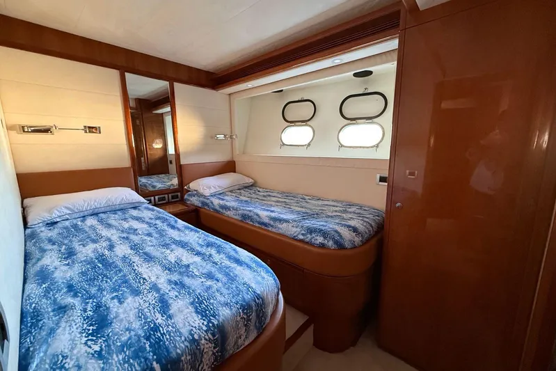  Yacht Photos Pics Luxurious twin bedroom in 2008 Ferretti Yachts 830 with elegant wood finishes.
