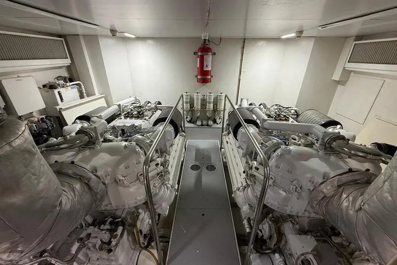  Yacht Photos Pics Engine room of 2008 Ferretti Yachts 830, featuring dual engines and fire extinguisher.