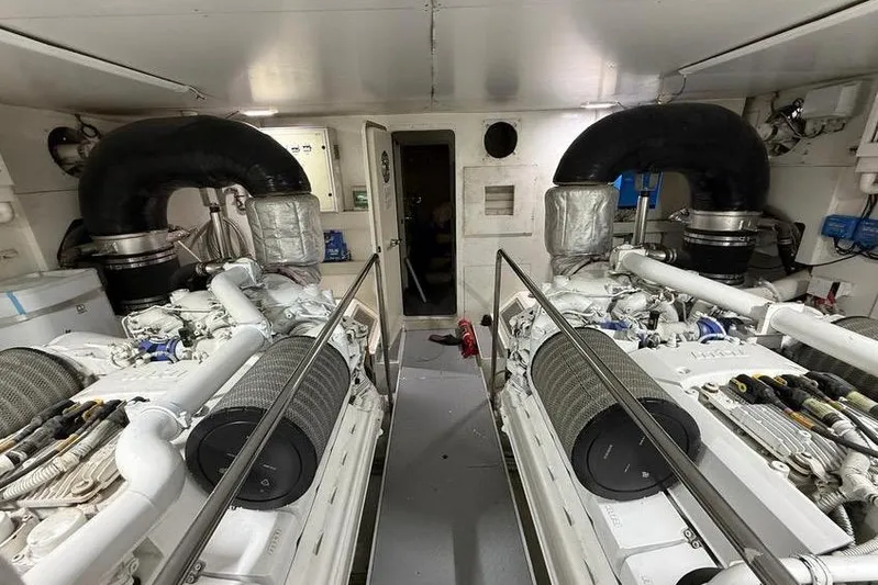  Yacht Photos Pics Engine room of a 2008 Ferretti Yachts 830, featuring dual engines and ventilation systems.