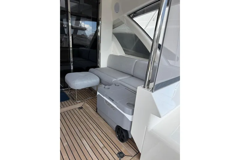  Yacht Photos Pics 2025 Riviera 50 Sports Motor Yacht interior with sleek seating and modern design.