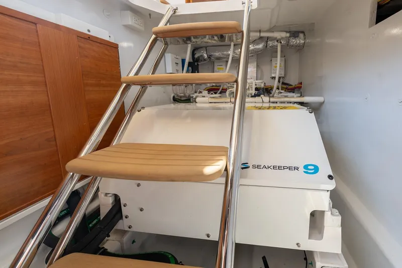 Lola Yacht Photos Pics Midships Upper Salon Storage Compartment with Seakeeper