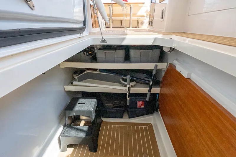 Lola Yacht Photos Pics Midships Upper Salon Storage Compartment for Large Dining Table