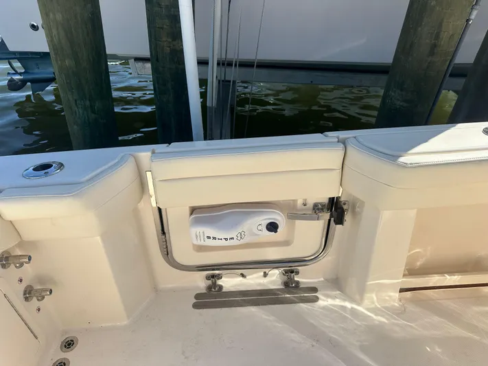  Yacht Photos Pics 2021 Grady-White 336 Canyon boat interior, featuring a clean, white deck and seating area.