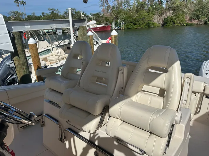  Yacht Photos Pics Grady-White 336 Canyon 2021 boat seats, docked by a scenic waterfront.