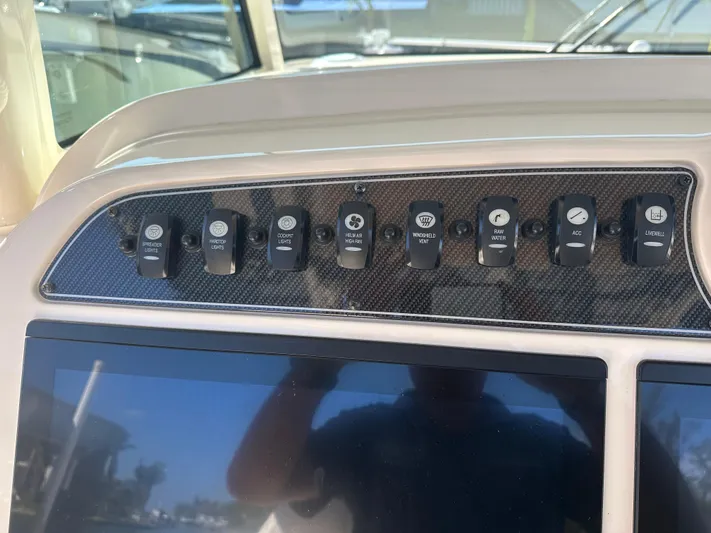  Yacht Photos Pics Control panel of 2021 Grady-White 336 Canyon boat with various switches.