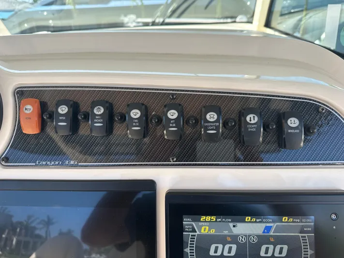  Yacht Photos Pics Control panel of 2021 Grady-White 336 Canyon boat with various switches.