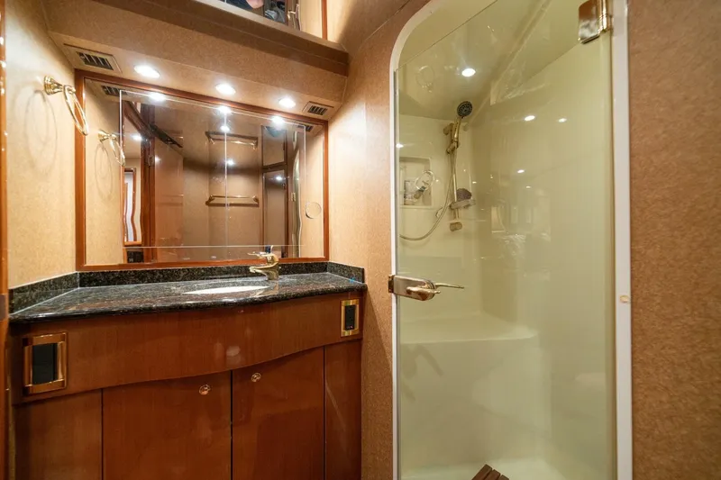Mariah Jean Yacht Photos Pics Luxurious bathroom in 2004 Viking 61c yacht with glass shower and elegant vanity.