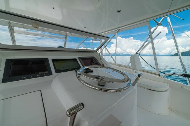 Mariah Jean Yacht Photos Pics Helm of 2004 Viking 61c yacht with ocean view and clear skies.