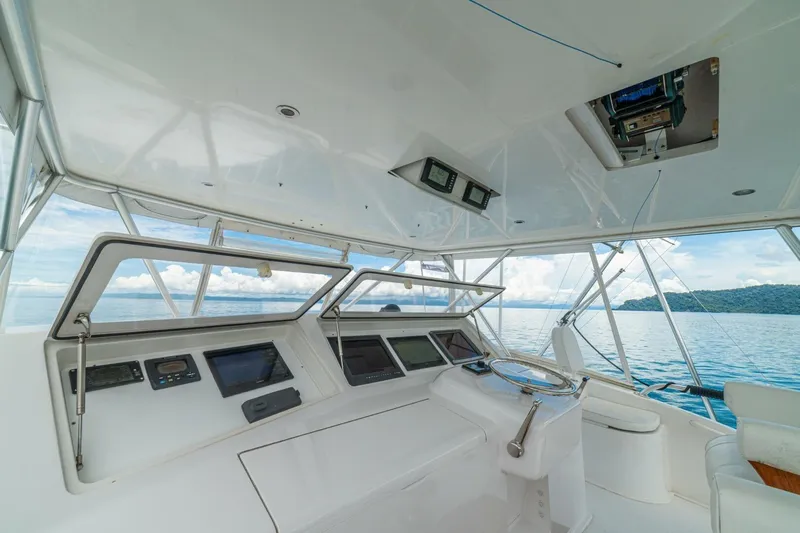 Mariah Jean Yacht Photos Pics Interior view of a 2004 Viking 61c yacht cockpit with ocean backdrop.