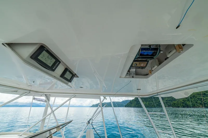 Mariah Jean Yacht Photos Pics Interior view of a 2004 Viking 61c yacht with electronic displays and ocean backdrop.