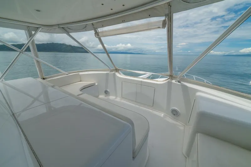 Mariah Jean Yacht Photos Pics Luxurious 2004 Viking 61c yacht interior with ocean view and sleek white seating.