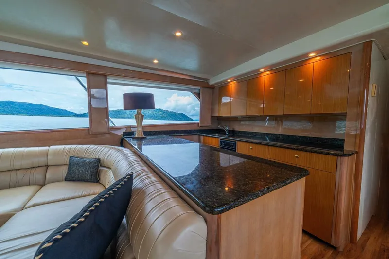 Mariah Jean Yacht Photos Pics Luxurious 2004 Viking 61c yacht interior with elegant wood cabinetry and scenic ocean view.