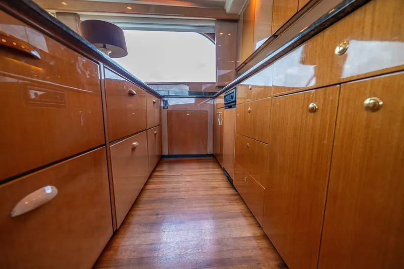 Mariah Jean Yacht Photos Pics Luxurious wooden kitchen interior on a 2004 Viking 61c yacht.