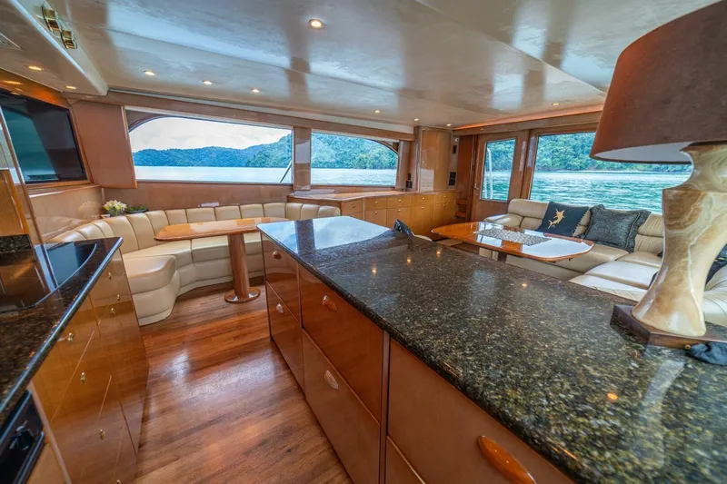 Mariah Jean Yacht Photos Pics Luxurious interior of 2004 Viking 61c yacht with elegant seating and scenic views.