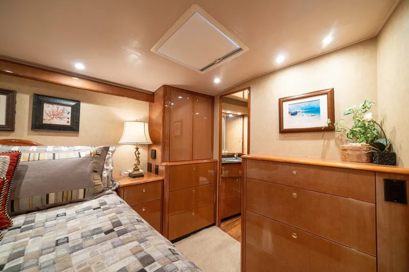 Mariah Jean Yacht Photos Pics Luxurious cabin interior of 2004 Viking 61 Convertible yacht with elegant wood furnishings.