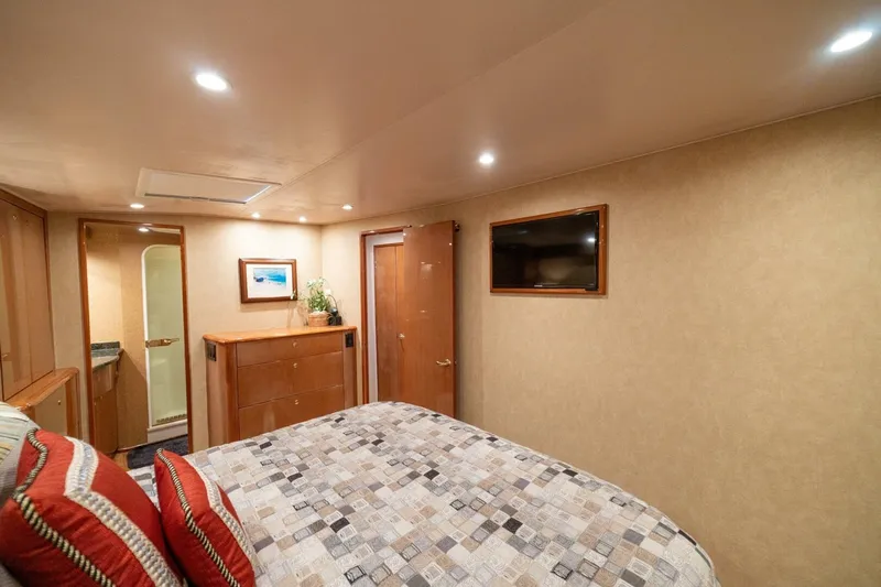 Mariah Jean Yacht Photos Pics Luxurious cabin interior of 2004 Viking 61 Convertible yacht with modern amenities.