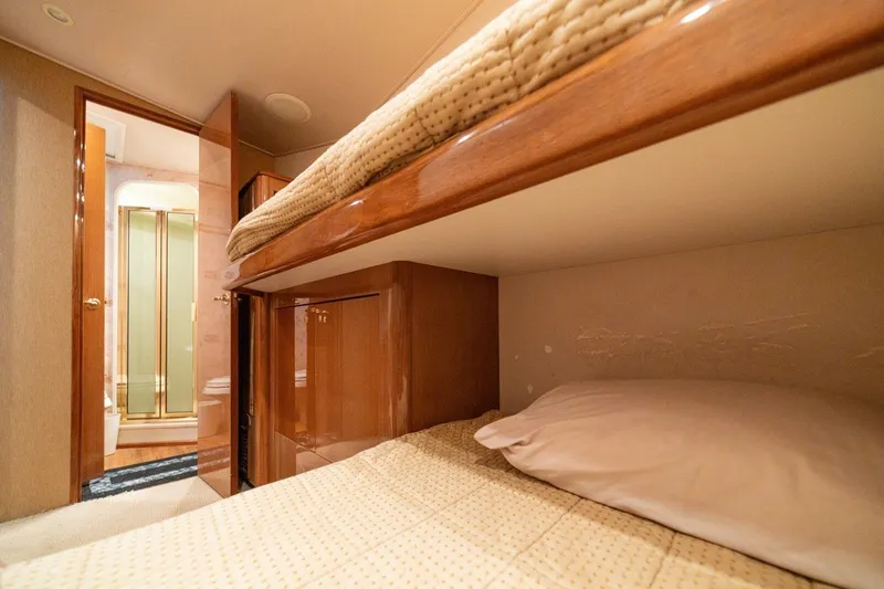 Mariah Jean Yacht Photos Pics Interior of 2004 Viking 61 Convertible yacht with cozy bunk beds and bathroom.