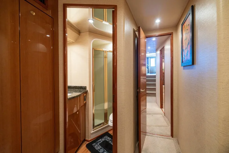 Mariah Jean Yacht Photos Pics Luxurious interior of 2004 Viking 61c yacht with hallway and bathroom.