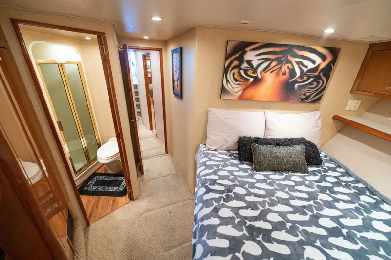 Mariah Jean Yacht Photos Pics Luxurious 2004 Viking 61c yacht bedroom with tiger artwork and ensuite bathroom.