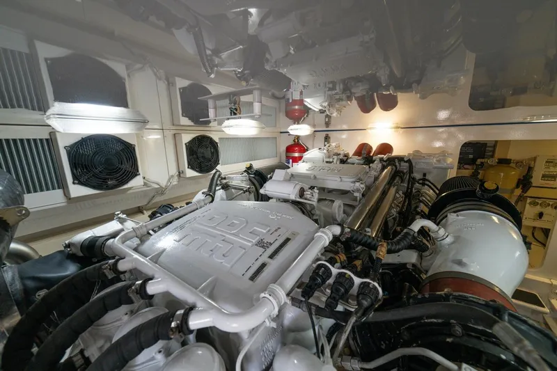 Mariah Jean Yacht Photos Pics Engine room of a 2004 Viking 61c yacht, featuring dual engines and ventilation systems.