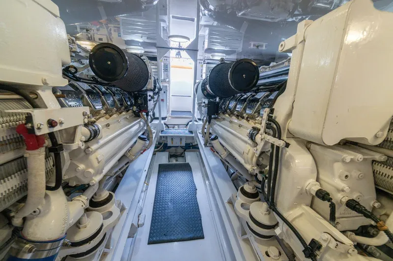 Mariah Jean Yacht Photos Pics Engine room of a 2004 Viking 61c yacht, showcasing dual engines and mechanical components.
