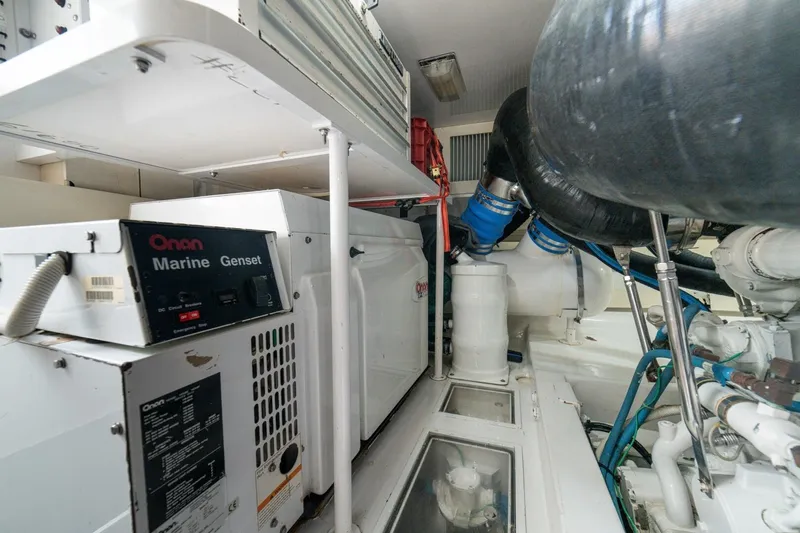 Mariah Jean Yacht Photos Pics Engine room of 2004 Viking 61c yacht with Onan marine generator.
