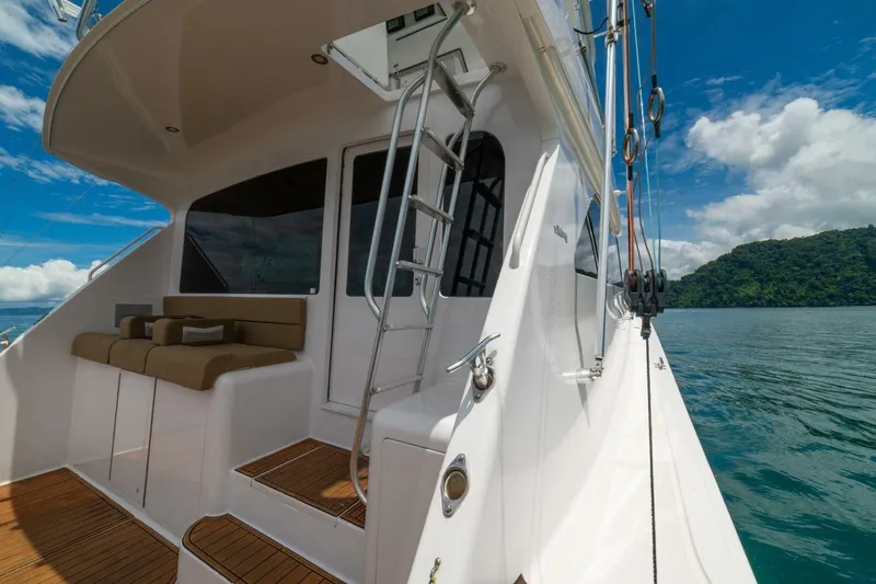 Mariah Jean Yacht Photos Pics 2004 Viking 61c yacht deck with seating, ladder, and ocean view.