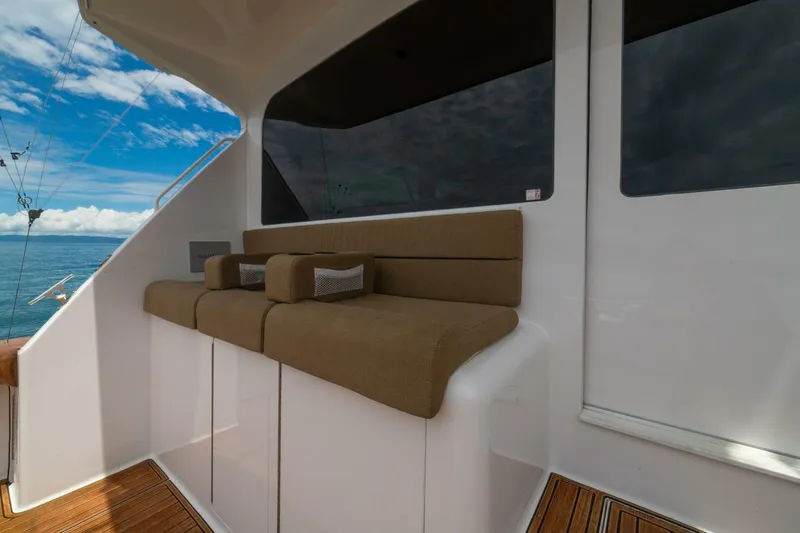 Mariah Jean Yacht Photos Pics 2004 Viking 61c yacht seating area with ocean view and blue sky.