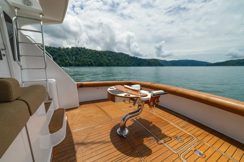 Mariah Jean Yacht Photos Pics Luxurious 2004 Viking 61c yacht deck with scenic ocean view and fishing chair.