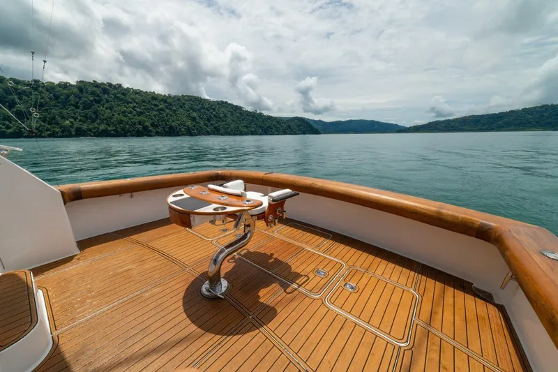 Mariah Jean Yacht Photos Pics 2004 Viking 61c yacht deck with scenic ocean and forested hills in the background.