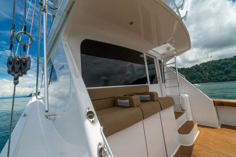 Mariah Jean Yacht Photos Pics 2004 Viking 61c yacht with outdoor seating, ocean view, and clear skies.