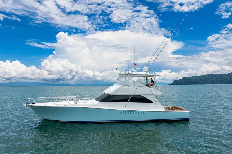 Mariah Jean Yacht Photos Pics 2004 Viking 61c yacht cruising on open water under a vibrant blue sky.