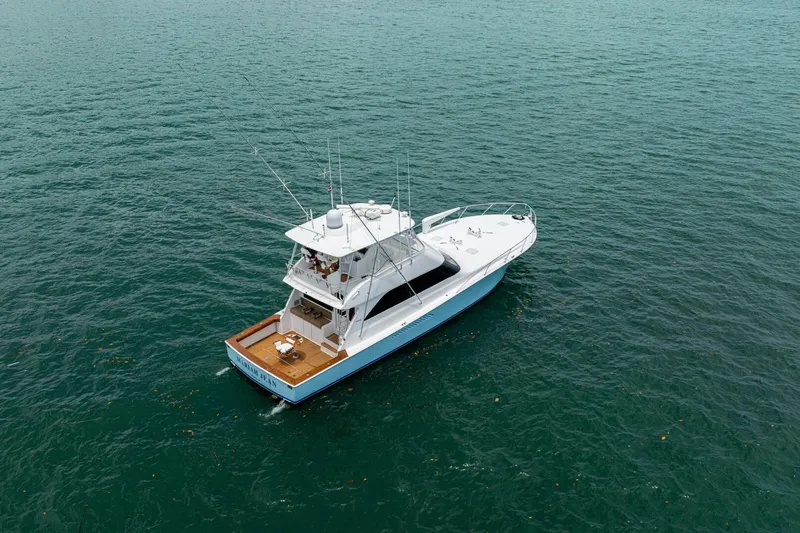 Mariah Jean Yacht Photos Pics Aerial view of 2004 Viking 61c yacht cruising on open water.