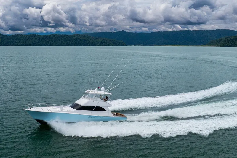 Mariah Jean Yacht Photos Pics 2004 Viking 61c yacht cruising on open water under cloudy skies.