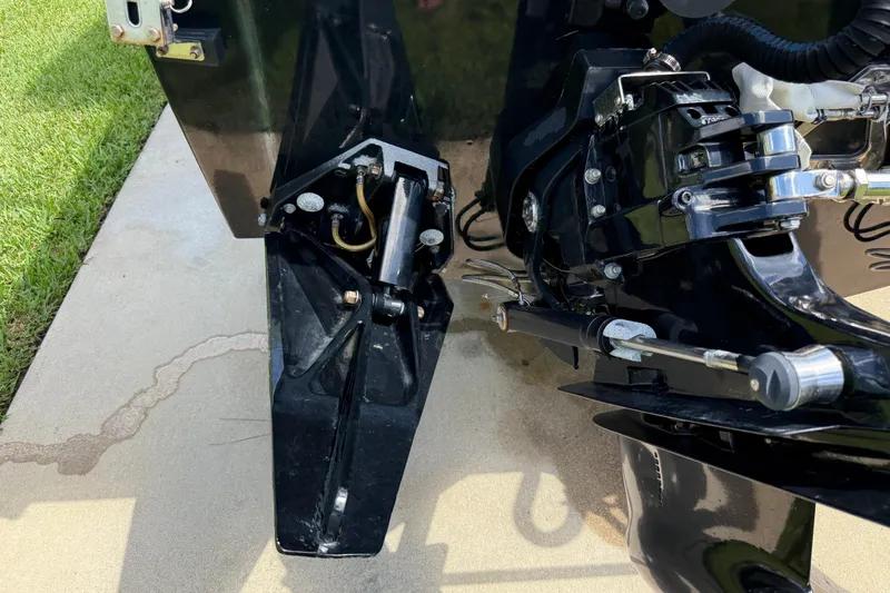  Yacht Photos Pics Close-up of a 2005 Apache 36CC boat engine components on a concrete surface.