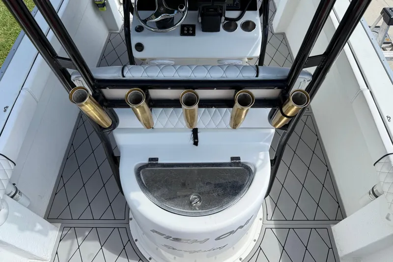  Yacht Photos Pics 2005 Apache 36CC boat interior with rod holders and steering console.