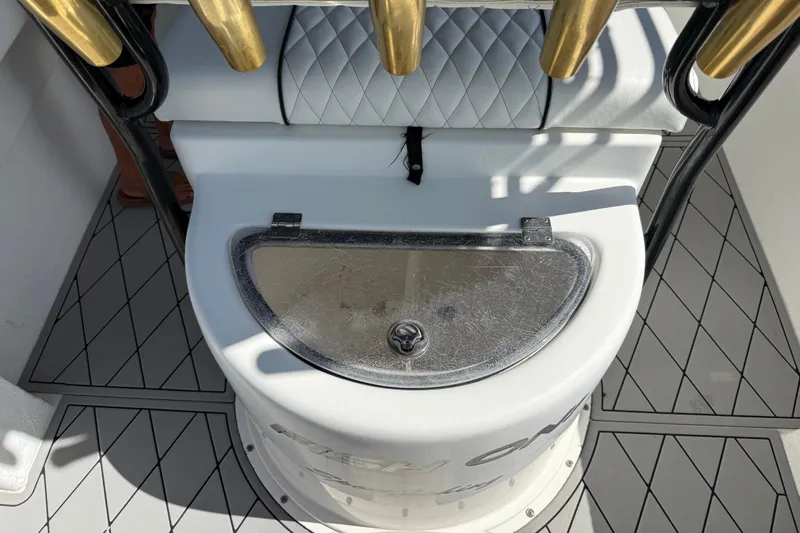  Yacht Photos Pics Fishing rod holders and storage compartment on a 2005 Apache 36CC boat deck.