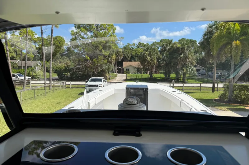  Yacht Photos Pics View from Apache 36CC boat, 2005 model, showing deck and lush surroundings.