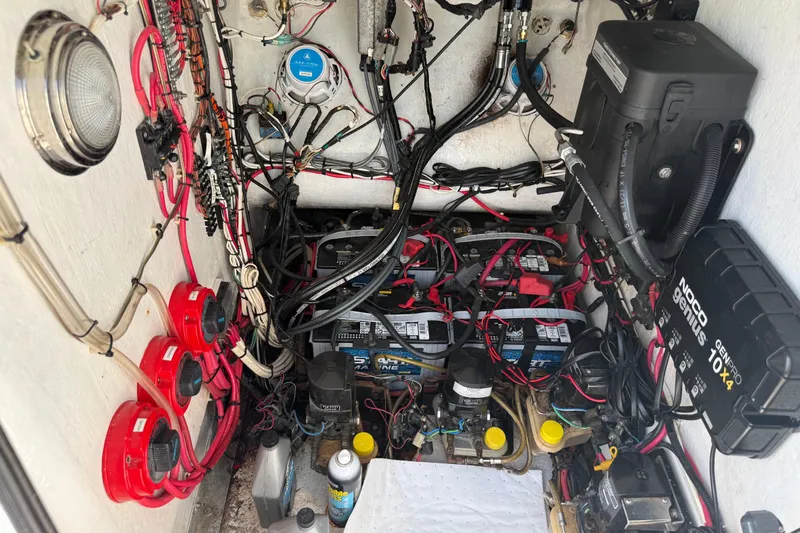  Yacht Photos Pics Electrical system of a 2005 Apache 36CC boat, featuring batteries and wiring components.