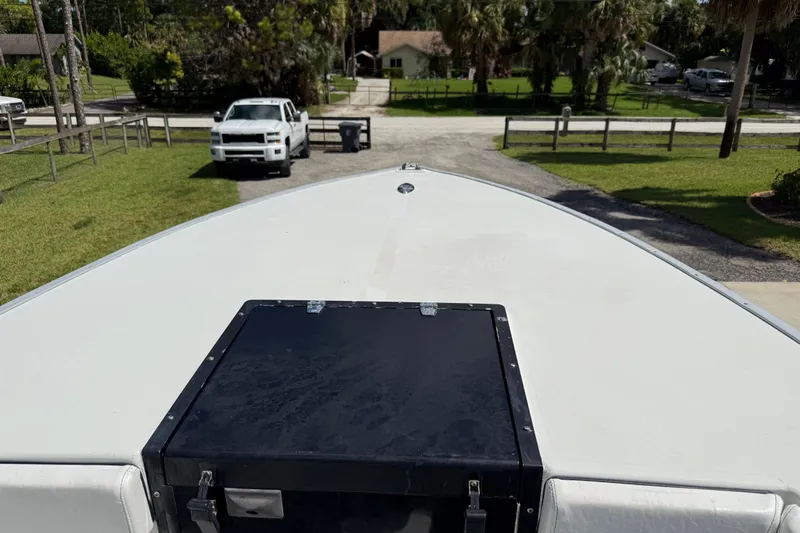  Yacht Photos Pics Bow of 2005 Apache 36CC boat with parked white truck in background.